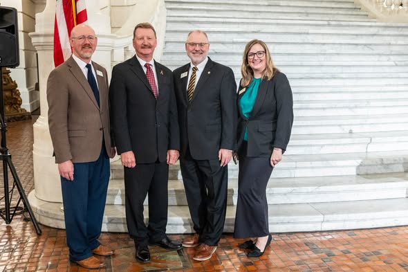 Sen. Vogel stands with members of the Geneva College Leadership Team.
